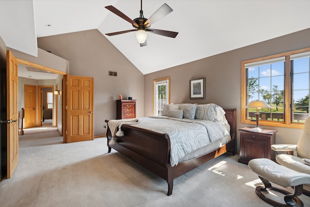 bedroom with ceiling fan, light colored carpet, and high vaulted ceiling