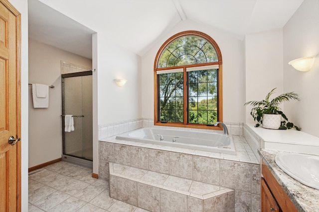 bathroom with tile patterned floors, vanity, separate shower and tub, and lofted ceiling