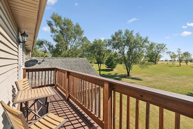 wooden deck featuring a yard