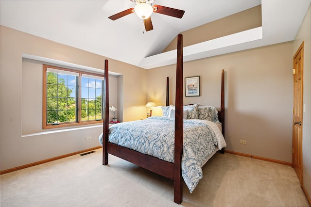 bedroom with ceiling fan, light colored carpet, and lofted ceiling