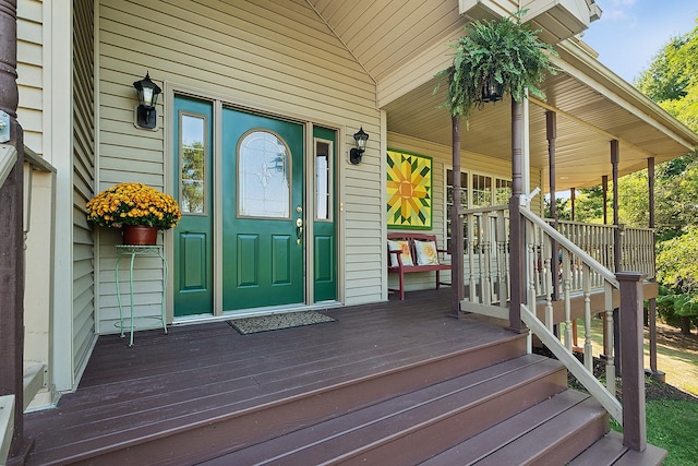 view of exterior entry featuring a porch