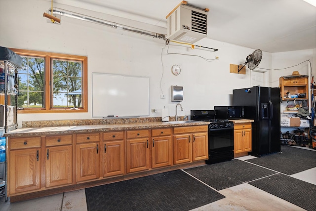 kitchen featuring sink and black appliances