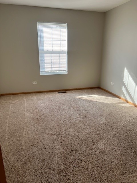 unfurnished room featuring carpet floors