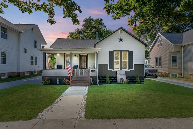 view of front facade featuring a yard and a porch