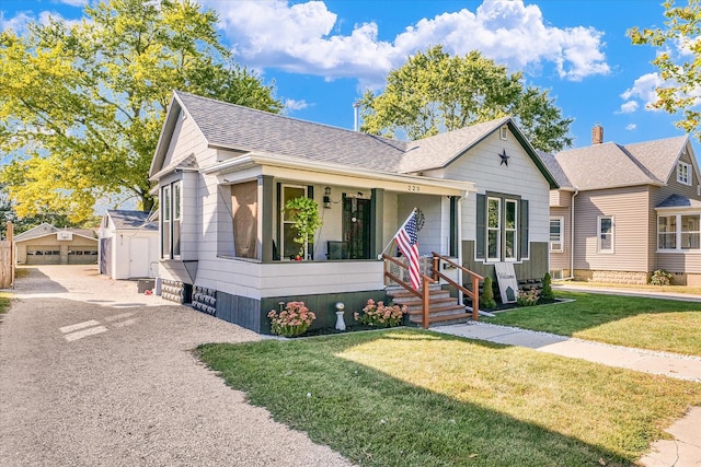 view of front of home with a front yard and a porch