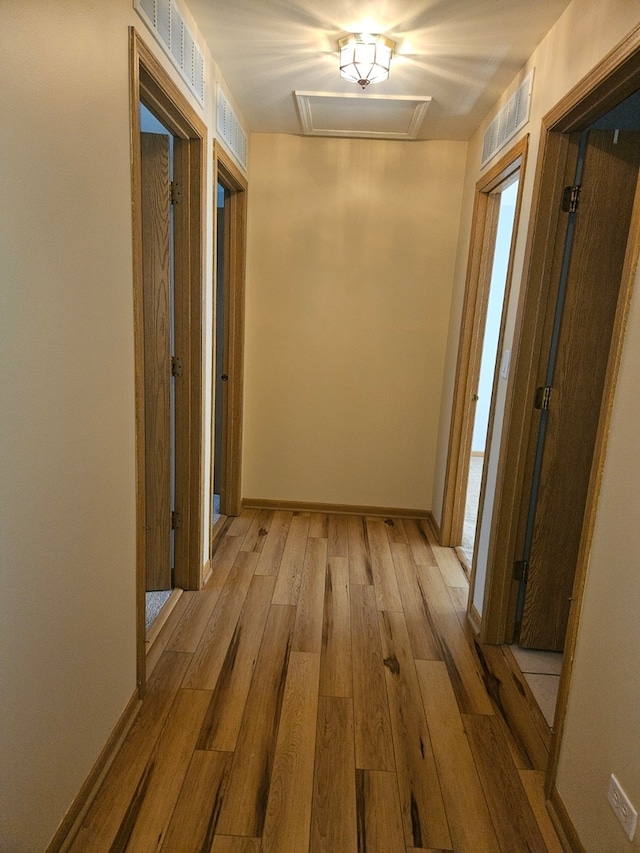 corridor featuring light hardwood / wood-style floors