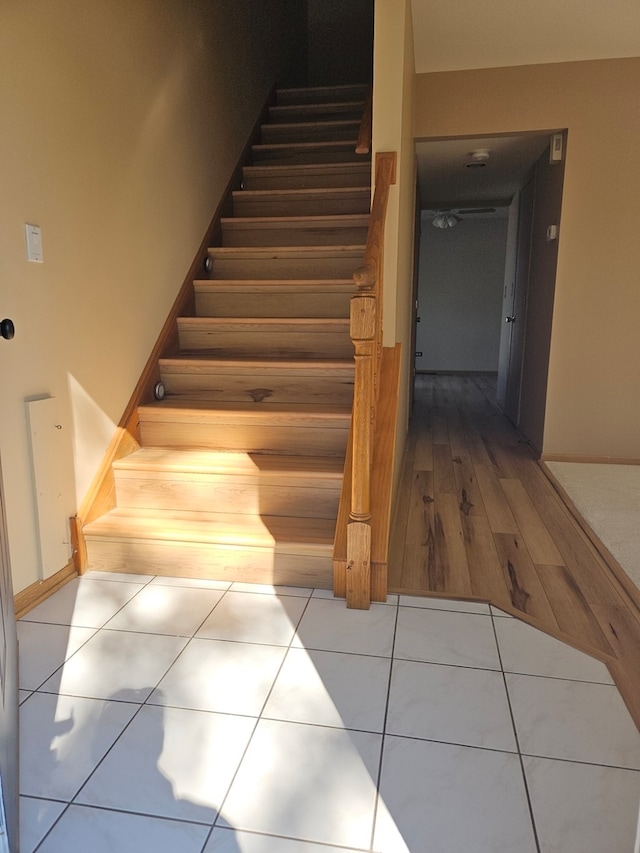 stairway with wood-type flooring