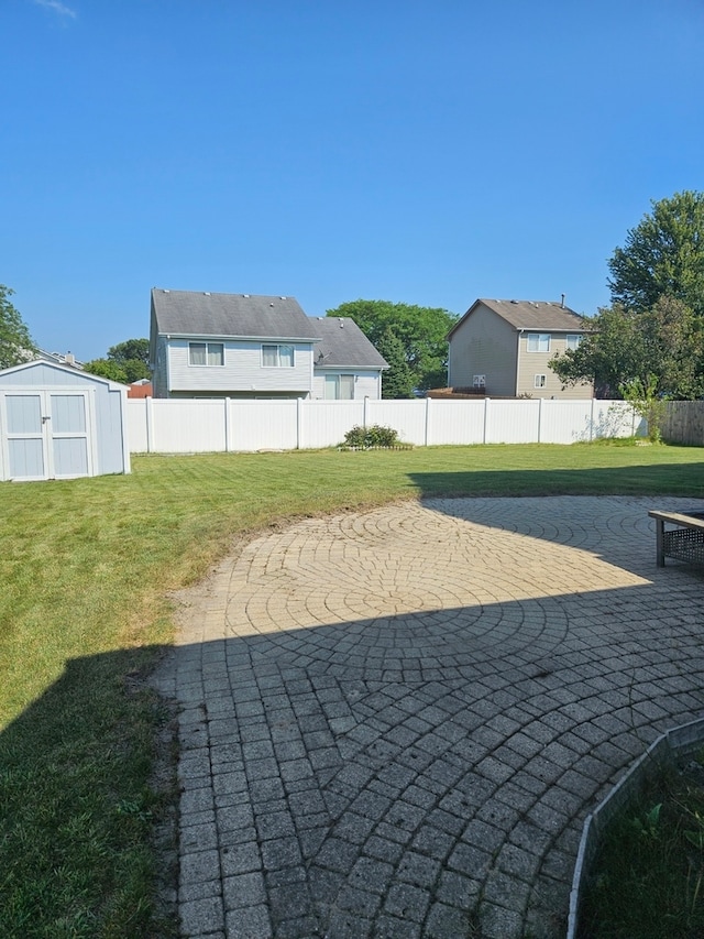 view of patio with a storage unit