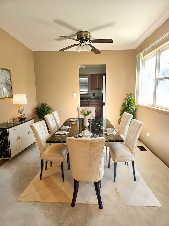 dining area featuring ceiling fan