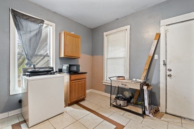 interior space with light tile patterned floors