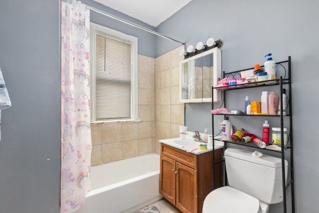 full bathroom featuring vanity, toilet, and shower / bath combination with curtain