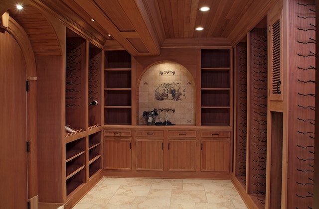 wine area featuring wood ceiling and built in features