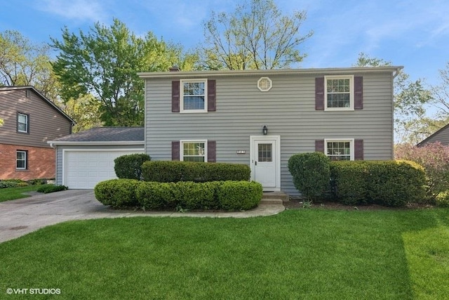 945 N Stark Dr, Palatine, IL 60074 - view of front of property featuring concrete driveway, a front lawn, and a garage
