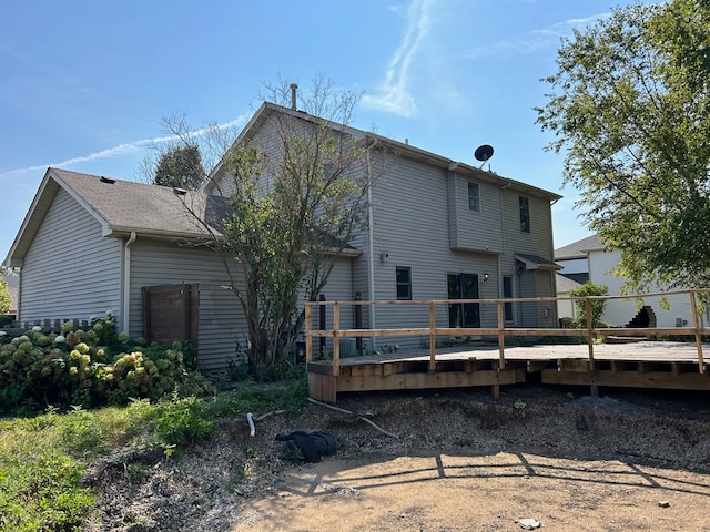 back of property with a deck