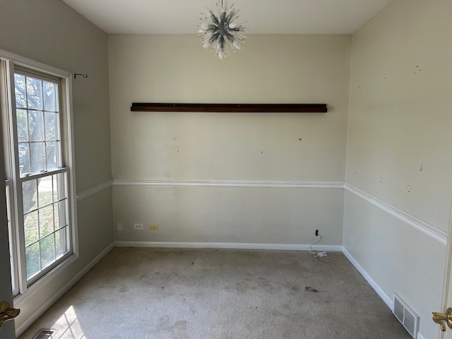 unfurnished room with light carpet