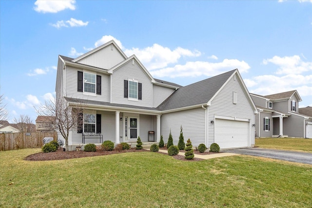 view of front of property featuring a garage, a porch, and a front yard