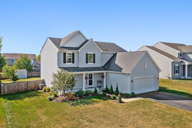 view of front property with a garage, a front yard, and central air condition unit