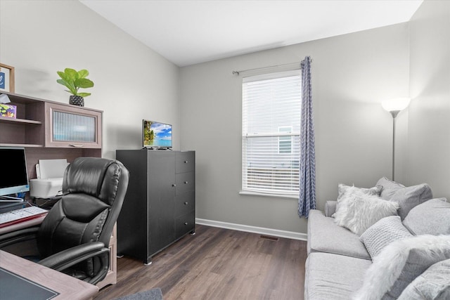 office area featuring plenty of natural light and dark hardwood / wood-style floors