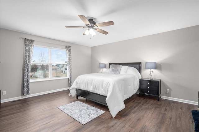 bedroom featuring dark wood-type flooring and ceiling fan