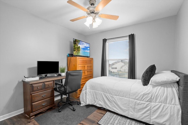 bedroom with ceiling fan and dark hardwood / wood-style flooring