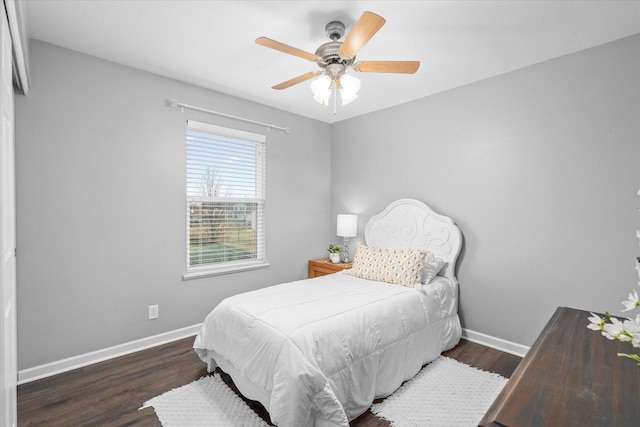 bedroom featuring dark hardwood / wood-style flooring and ceiling fan