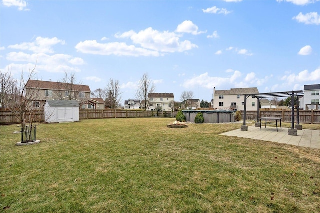 view of yard with a fenced in pool, a pergola, a patio area, and a shed