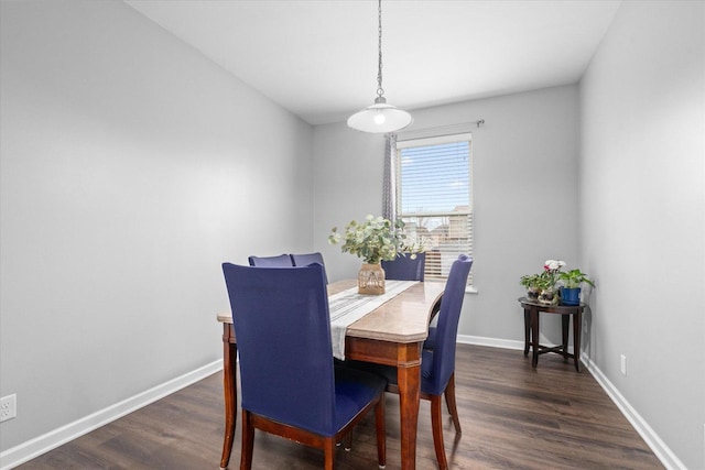 dining space with dark wood-type flooring