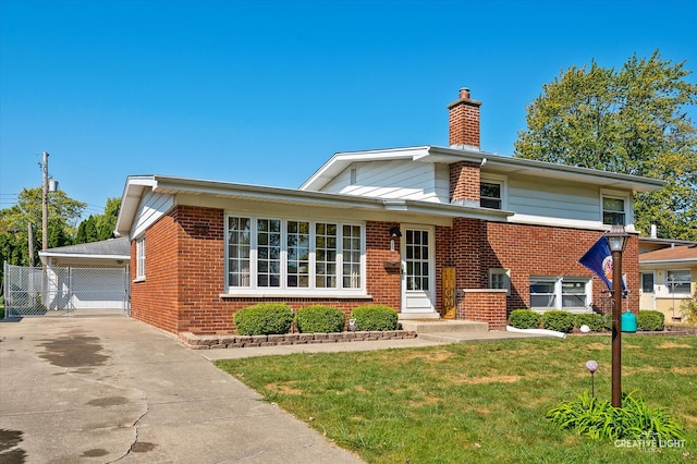 view of front of house featuring an outdoor structure, a front yard, and a garage