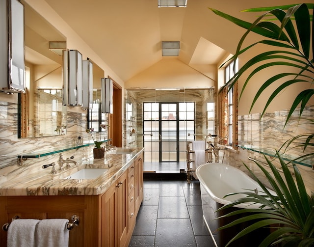 kitchen with vaulted ceiling and sink