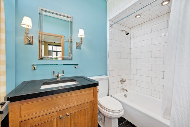 full bathroom with shower / bath combo with shower curtain, tile patterned floors, vanity, and toilet