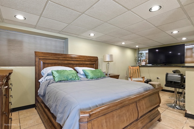 tiled bedroom with a paneled ceiling