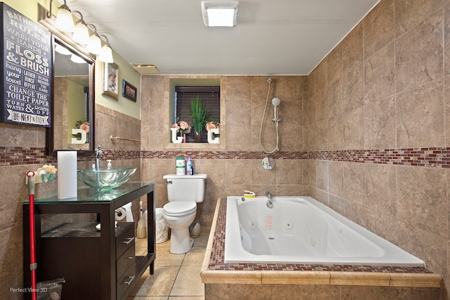 full bathroom with vanity, toilet, independent shower and bath, tile walls, and tile patterned flooring