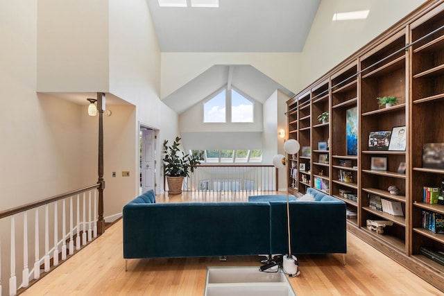 interior space featuring wood-type flooring and high vaulted ceiling