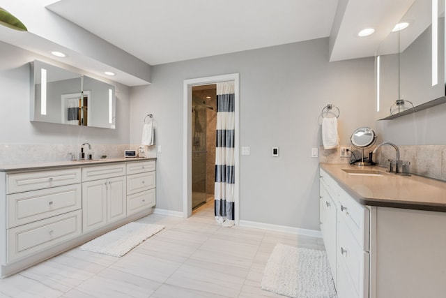 bathroom featuring walk in shower and vanity