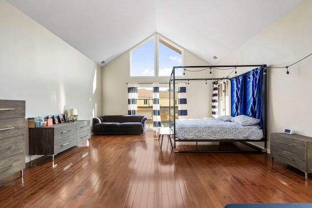 bedroom featuring hardwood / wood-style flooring and high vaulted ceiling