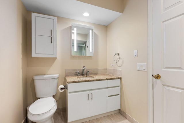 1204 Hawthorne Ln, Hinsdale, IL 60521 - bathroom featuring recessed lighting, vanity, baseboards, and toilet