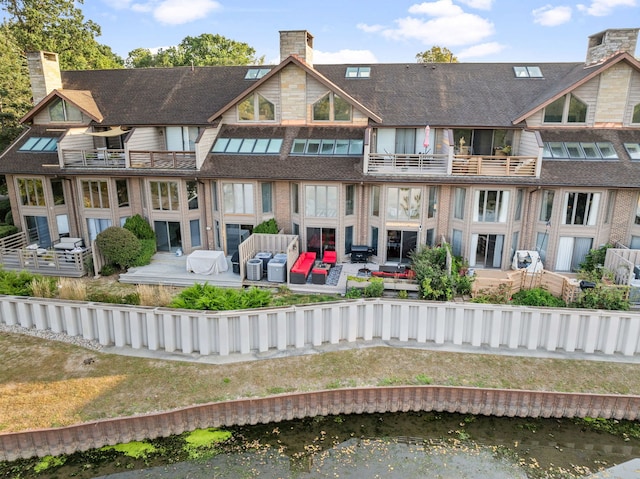 1204 Hawthorne Ln, Hinsdale, IL 60521 - back of house with a chimney and a balcony