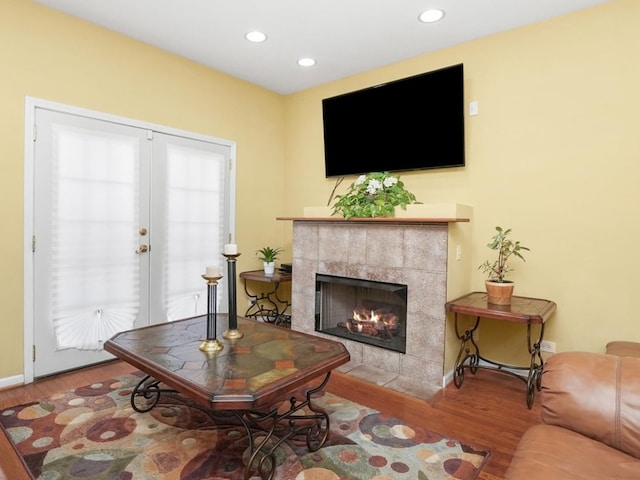 living room with a fireplace and hardwood / wood-style flooring