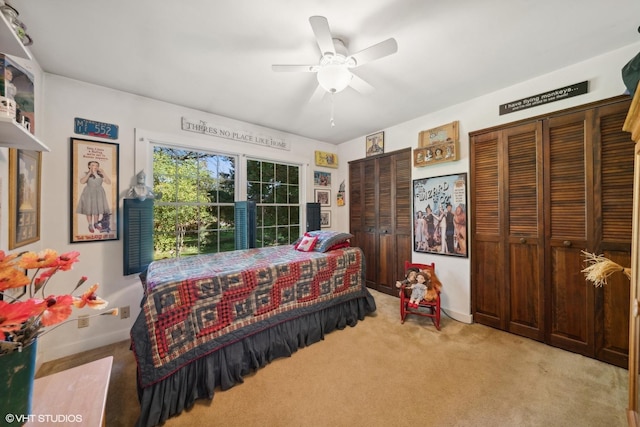 33 E Maple Ave, Cortland, IL 60112 - bedroom featuring light colored carpet, multiple closets, a ceiling fan, and baseboards