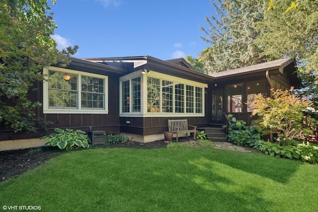 33 E Maple Ave, Cortland, IL 60112 - back of property with a yard and central air condition unit
