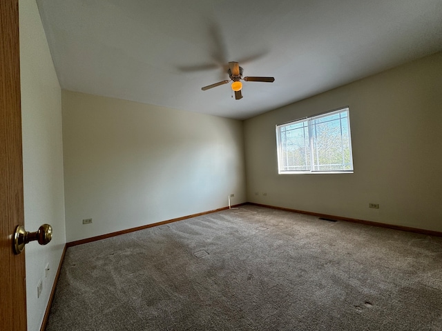 unfurnished room with ceiling fan and carpet floors