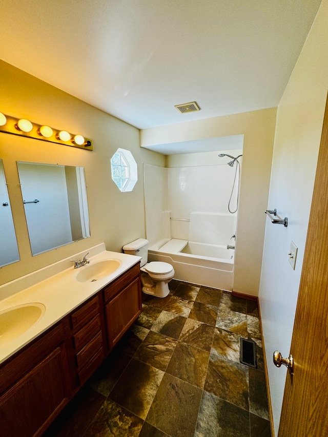 full bathroom with vanity, bathing tub / shower combination, and toilet