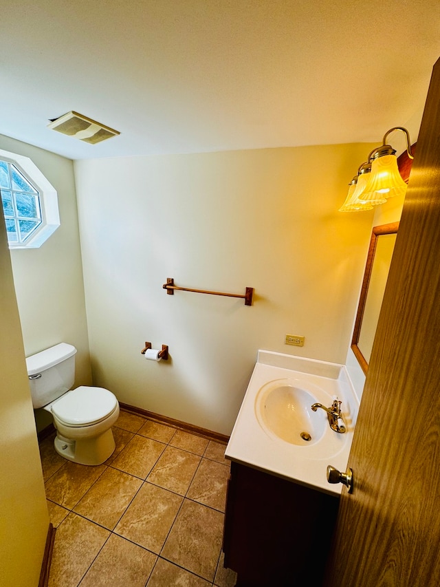 bathroom featuring vanity, toilet, and tile patterned floors