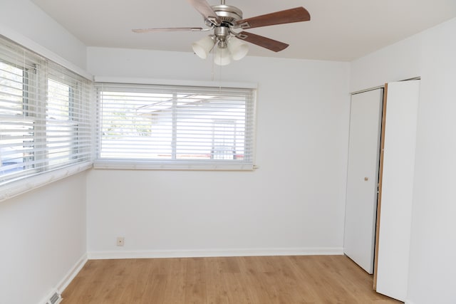 unfurnished room featuring light hardwood / wood-style floors and ceiling fan