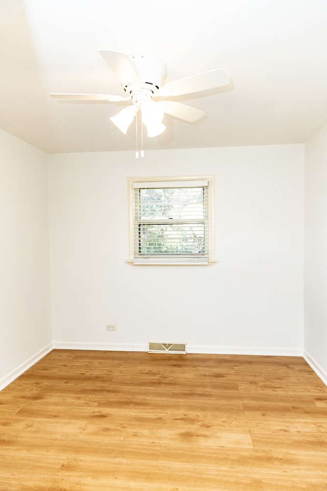 unfurnished room with light hardwood / wood-style flooring and ceiling fan