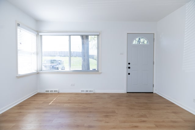 foyer entrance featuring light wood-type flooring