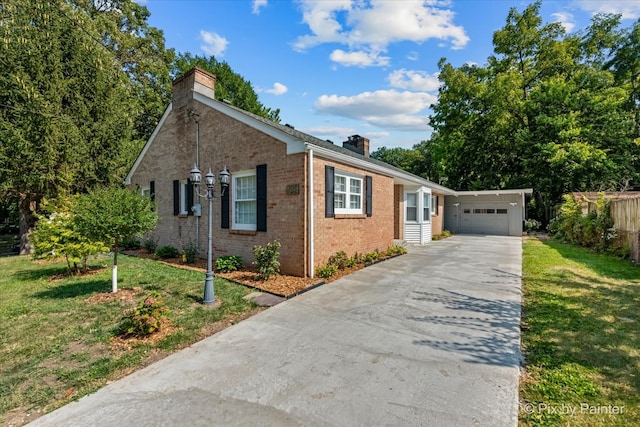 view of front of house with a garage and a front lawn