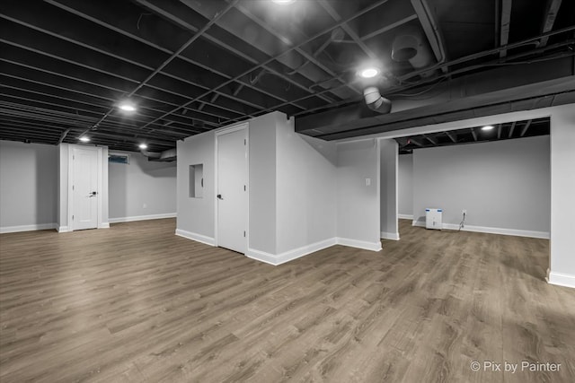 basement featuring hardwood / wood-style flooring