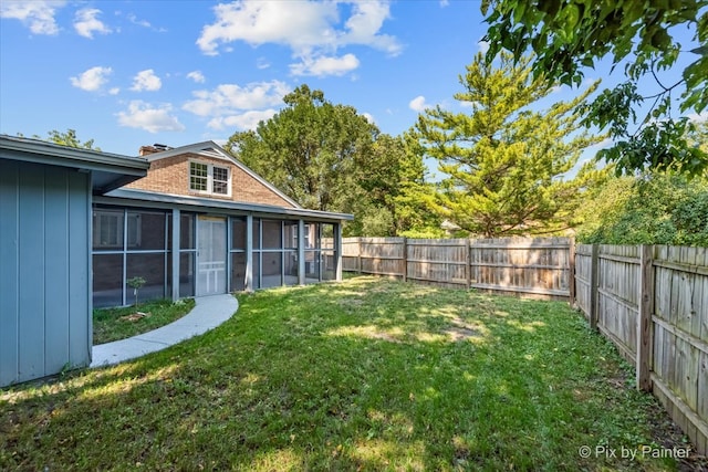 view of yard with a sunroom