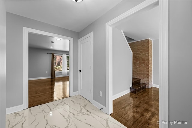 hall with hardwood / wood-style floors